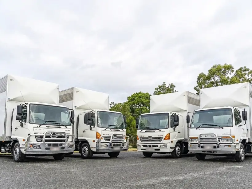 SAMA Removals interstate truck fleet parked in a row